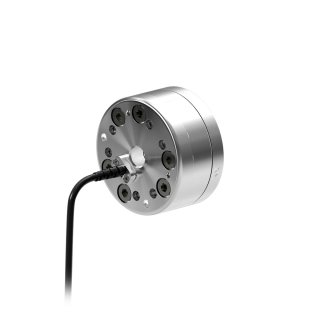 Un pequeño sensor de par de fuerza con cable externo de puerto radial